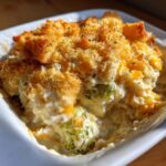 Close-up of a creamy chicken broccoli casserole with a golden, crunchy breadcrumb topping.